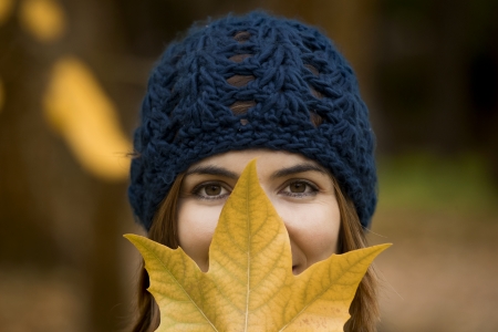 Happy woman in a beautiful autumn dayの写真素材