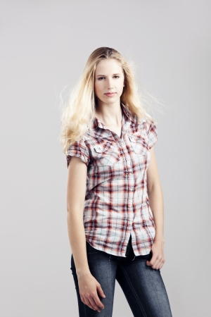 Beautiful young woman over a gray backgroundの写真素材