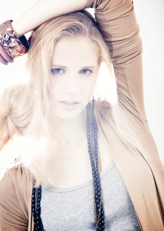 Beautiful fashion woman posing over a white backgroundの写真素材
