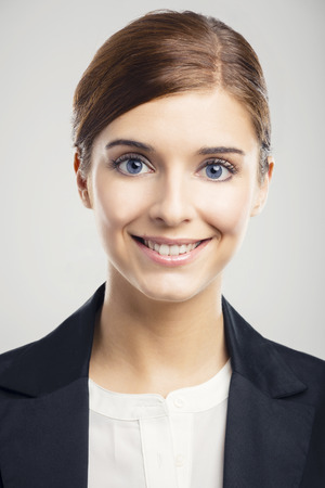 Portrait of a beautiful blonde woman with blue eyes smilingの写真素材