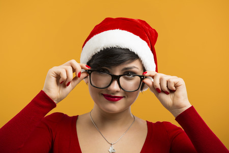 Beautiful and sexy girl wearing santa clause hatの写真素材