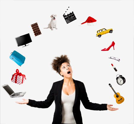 A Beautiful Afro-American woman juggling multiple objects over the air