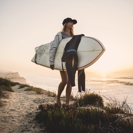 Beautiful female Surfer looking for the wavesの写真素材