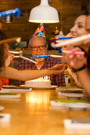 Big family celebrate the birthday of the grandfather