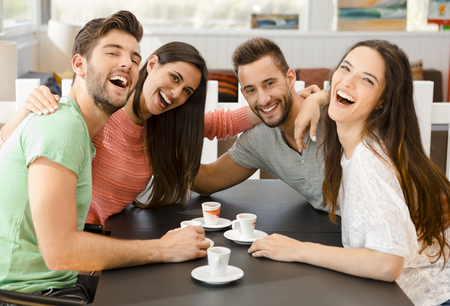 Friends having a great day at the local coffee shopの写真素材