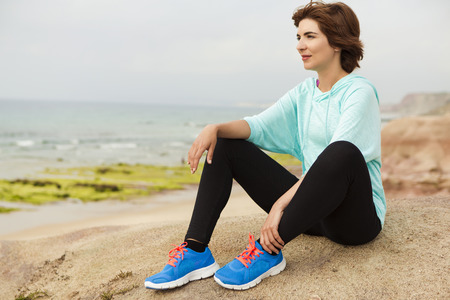 Woman in a relaxed moment after exerciseの写真素材
