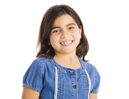 Studio portrait of a beautiful girl smiling, isolated over white background