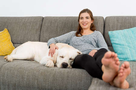 Beautiful woman at home with her best friendsの写真素材