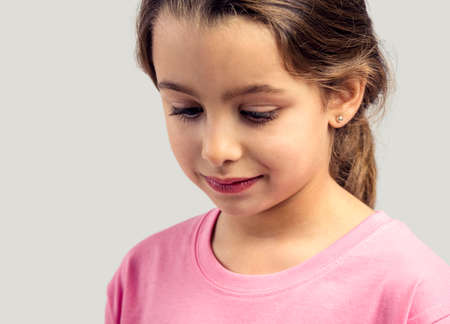 Studio portrait of a beautiful little girlの写真素材