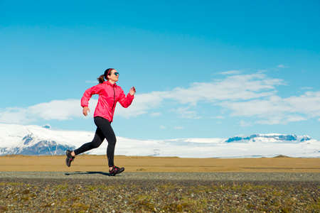 Woman running on a winter dayの写真素材