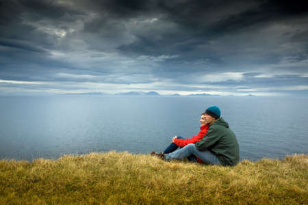A couple contemplating the beautiful landscapeの写真素材