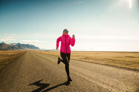 Woman running on a winter day