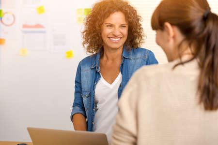 Shot of two businesswoman working together in an officeの写真素材
