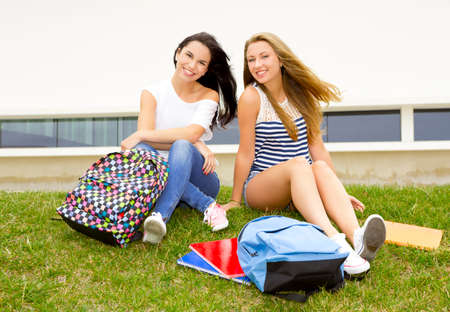 Beautiful and happy teenage students in the school