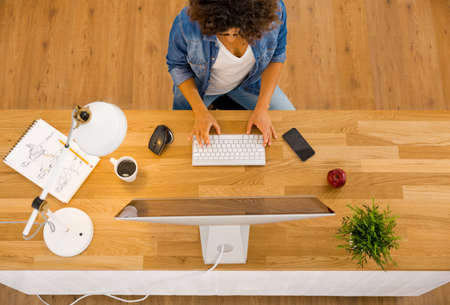 Top view of businesswoman working in an officeの写真素材