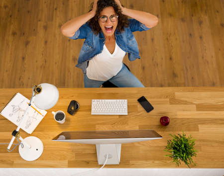 Top view of businesswoman in paning while working in an office