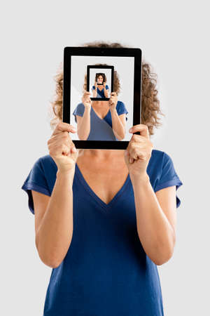 woman holding a tablet