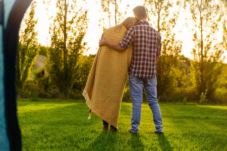 Young couple in love after waking up in the natureの写真素材
