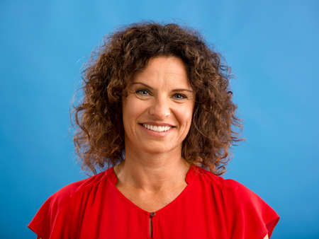Portrait of a beautiful woman over a blue background