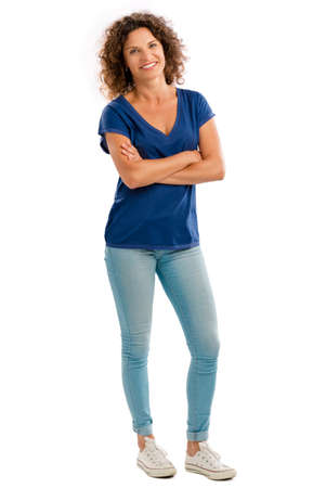 Smiling middle aged woman with arms folded, isolated on white backgroundの写真素材
