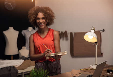 A young fashion designer working on her atelierの写真素材