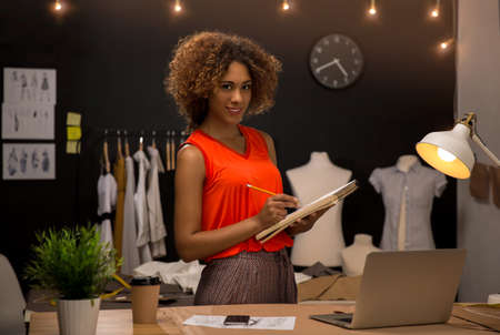 A young fashion designer working on her atelierの写真素材