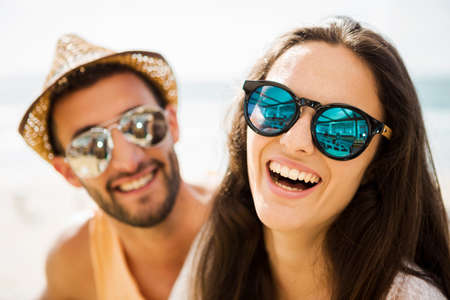 Fiends having a great time together at the beach barの写真素材