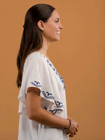 Studio portrait of a beautiful young woman smiling