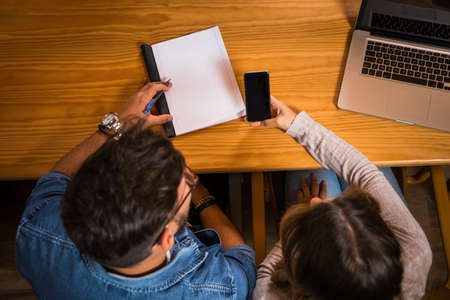 Group of young people studying together for the upcoming examsの写真素材