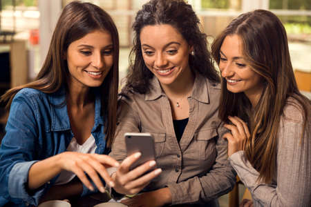 Group of girls making a pause on the studies for some gossip