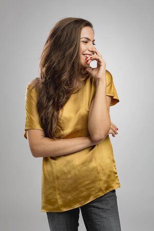 Beautiful young woman with a great smile laughingの写真素材