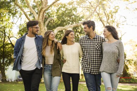Group of friends having  a great day in the park