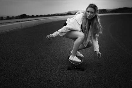 Girl making a downhill with her Skateの写真素材