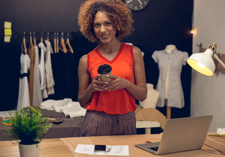 A young fashion designer working on her atelierの写真素材