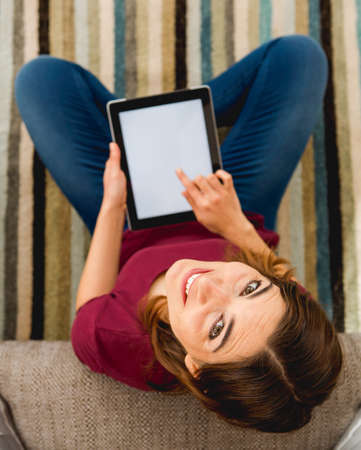 Woman using a digital tabletの写真素材