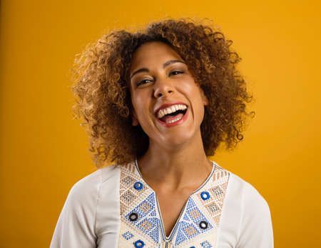 Portrait of a beautiful African American woman smilingの写真素材