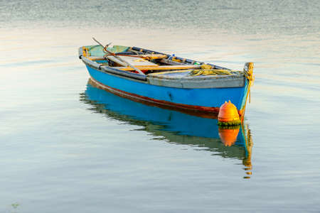 Beautiful old fishing boats resting on the lake