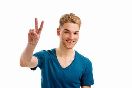 Young man with a smiley face, isolated on white backgroundの写真素材