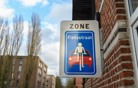 A road sign in Belgium indicating the benefits of cyclists on this street. Inscription in Dutch - Bicycle Street Zoneの写真素材