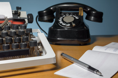 Retro typewriter, checkbook, old telephone, ink pen. lettering in french - received from mr. forの写真素材