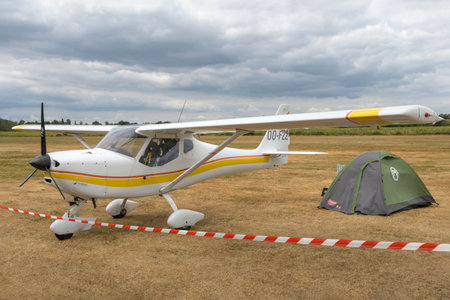 Hasselt. Limburg - Belgium 27-08-2022 Light white single-engine aircraft on the runway. A small tent...