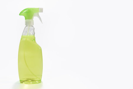Spray bottle with green detergent. on a white background with a copy spaceの写真素材