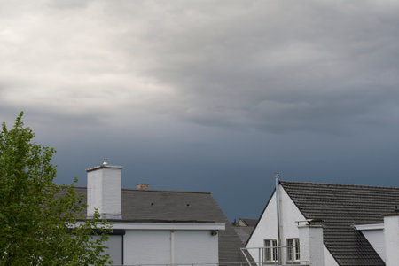 Thunderclouds over rooftops. Starting from the rainの写真素材