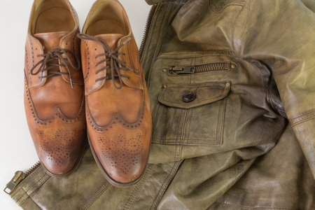 Classic leather accessories for menswear. Genuine leather products - jacket and shoes