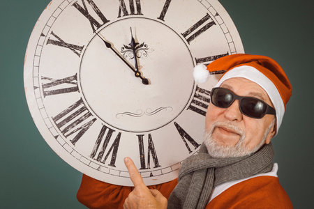 Santa with big antique clock mock up. Close-upの写真素材