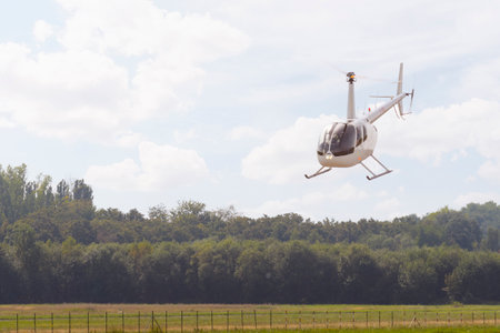 Sint Truiden. Limburg - Belgium 03-09-2023. Robinson R44 Raven 2 in fly. Public airshow of vintage aircraft at the Sint Truiden Aero Clubのeditorial素材