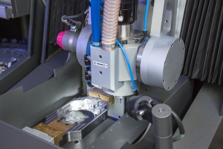 Milling or drilling machine in a dental lab