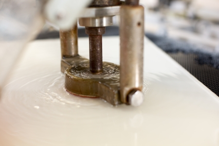 A glass drilling and milling machine in glazier's workshopの写真素材