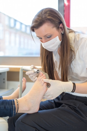 pedicure grinding toe nails of customerの写真素材