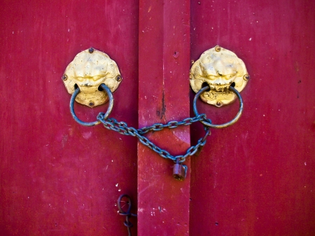 old red door in temple of Thailand,Traditional  of window and door in art Thai style at the temple of thaindの写真素材